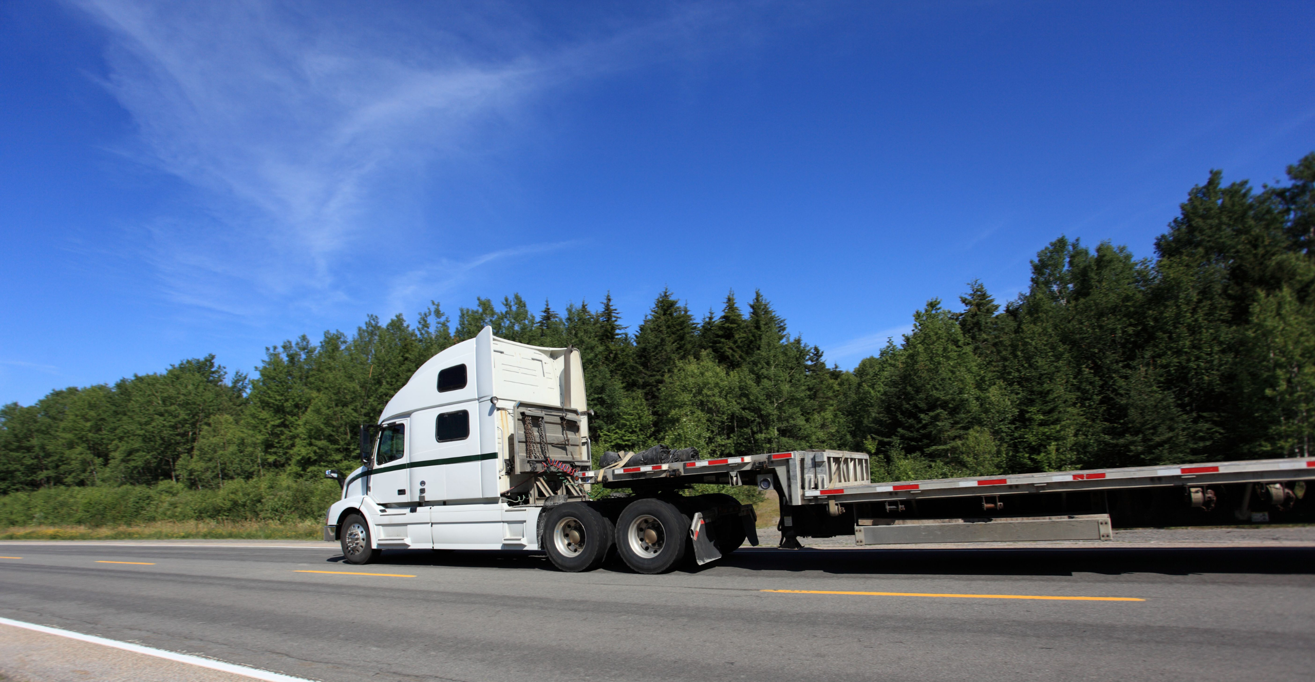 Rolls Right flat deck trailer for heavy haul and oversized freight
